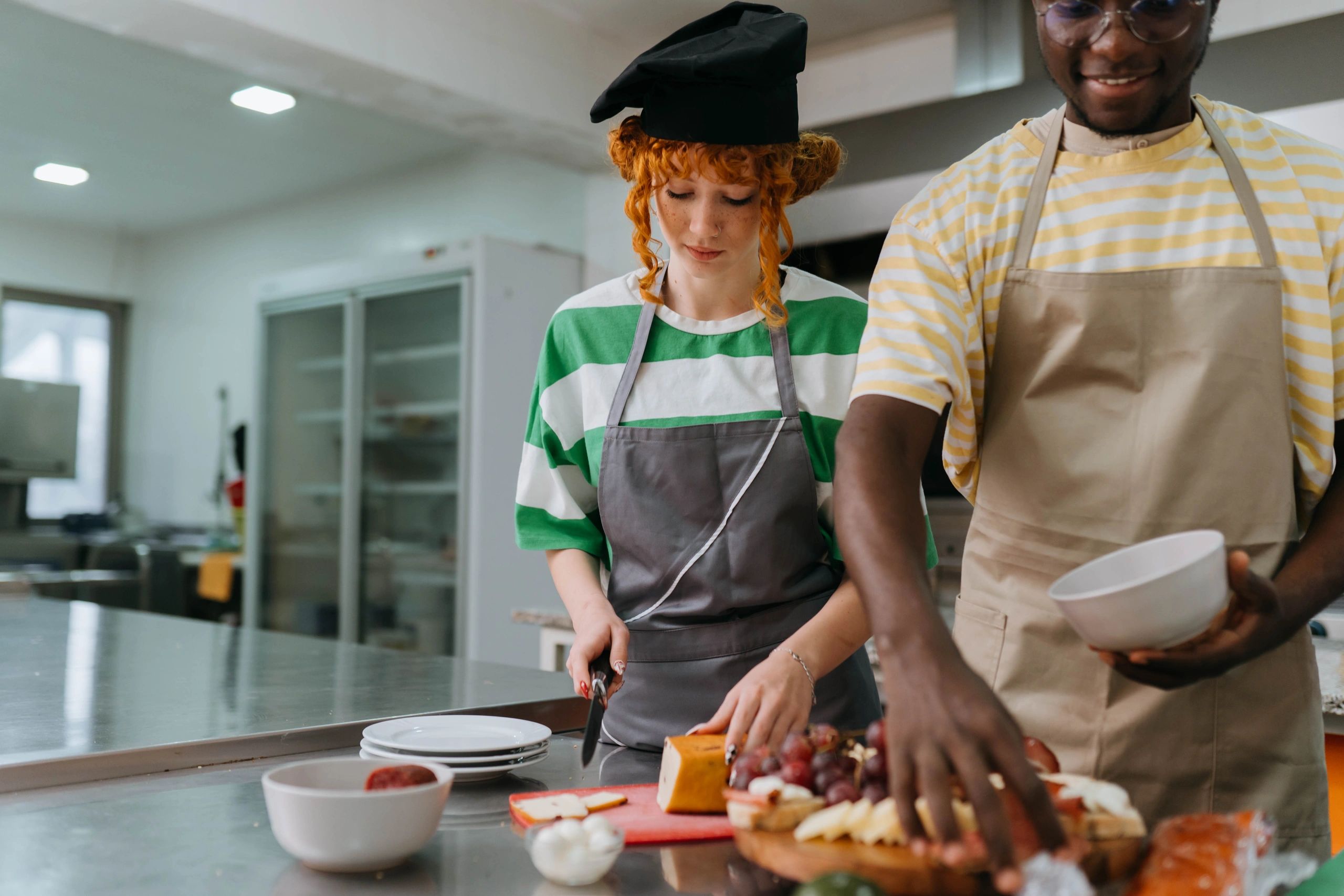 Students learning with a chef during a pastry class